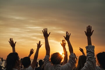 group of people with their hands up looking at the sunset - obrazy, fototapety, plakaty