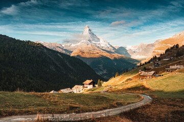 Landscape of Matterhorn mountain and rustic village on hill in Switzerland