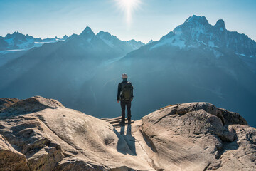 A male hiker enjoying the Mont Blanc mountain view during trail of Lac Blanc at France