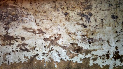 Grungy concrete wall texture with scratched paint.