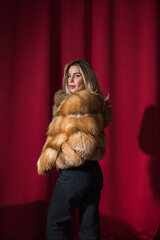 Fur coat trend. Attractive European lady in furs. Fashionable details of woman wardrobe