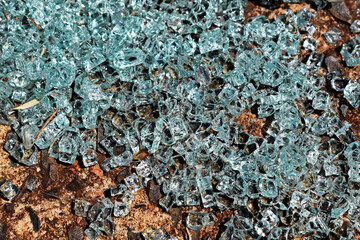 Car windshield glass fragments on floor