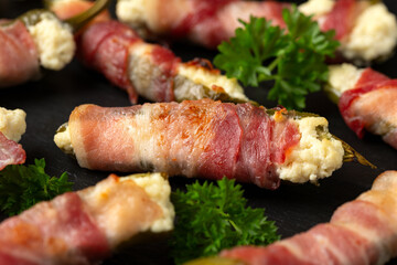 Homemade Bacon Wrapped Jalapeno Poppers with Cream Cheese and herbs.
