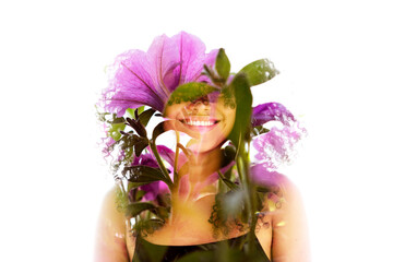 A double exposure portrait of a smiling woman merged with pink flowers