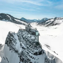 Foto op Plexiglas Jungfraujoch - Top of Europe. Surrounded by glaciers and eternal snow. Observation deck with fantastic panorama. Drone Photo © Marc