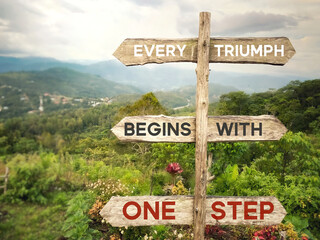 Every triumph begins with one step text in vintage background. Inspirational quote concept. Stock photo.