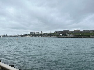 Plymouth sound sea on a grey winters day with sailing yacht in the United Kingdom. 