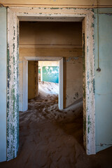 Inside of an abandoned building with textured old walls in an old desert town