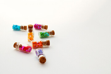 Glass disordered bottles each containing hearts of different colors