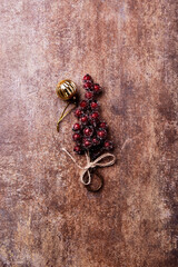 Christmas branch on rustic stone background. Top view. Copy space.