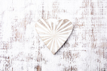 Wooden Heart on bright background. Top view. Close up. Copy space.	