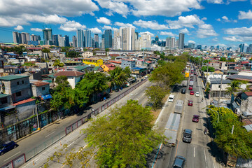 Taguig, Metro Manila, Philippines - Aerial of C5 road, old Taguig, Mckinley Village, and BGC...