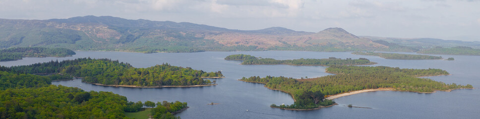 Loch Lomond aerial view showing islands Inchtavannach, Inchconnachan, Inchcruin and Inchfad