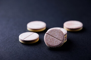 Vitamin effervescent Tablets on paper background. Close up. Copy space.	