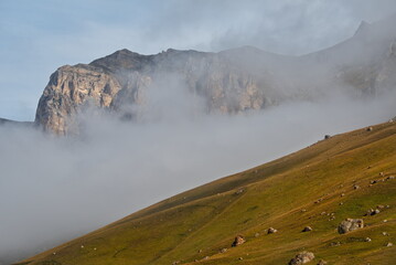 Russia. The Elbrus region. The high mountain peaks of the North Caucasus are surrounded by morning...