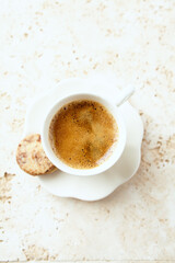 Cup of Coffee on bright stone background. Close up.	