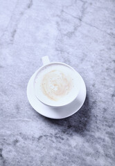 Obraz na płótnie Canvas Cup of Coffee on bright stone background. Close up. 