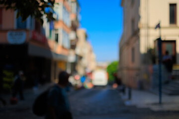 Blur texture background for design. Out of focus views of the streets of an eastern city on a sunny...