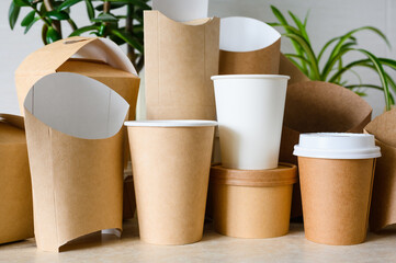 Close-up of several paper cups and fast food containers. Zero waste concept and use of biodegradable materials for production