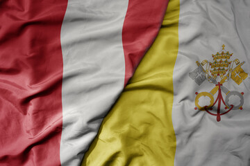 big waving national colorful flag of vatican city and national flag of peru .