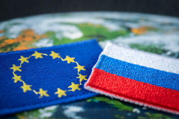 Russia and the European Union, Symbols of Russia and the EU flag on the background of the world map, Mutual relations and politics