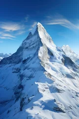 Foto op Canvas Majestic snow-covered mountain peak under blue sky ideal for travel and tourism industries conveying grandeur adventure altitude and natural wonder © Made360