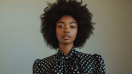 Chic Woman in Black Blouse with White Polka Dots on Gradient Background