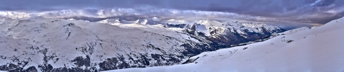 Breathtaking beautiful panoramic view on Snow Alps - snow-capped winter mountain peaks around French Alps mountains, The Three Valleys: Courchevel, Val Thorens, Meribel (Les Trois Vallees), France
