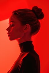 Sculptural Woman in Monochromatic Vision Against Vivid Red