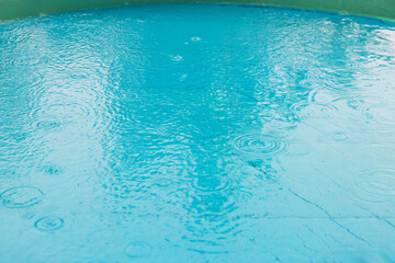 Beautiful view of water in the outdoor children's pool during rain.