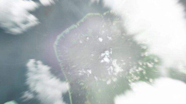 Earth zoom in from space to Palikir, Micronesia. Followed by zoom out through clouds and atmosphere into space. Satellite view. Travel intro. Images from NASA