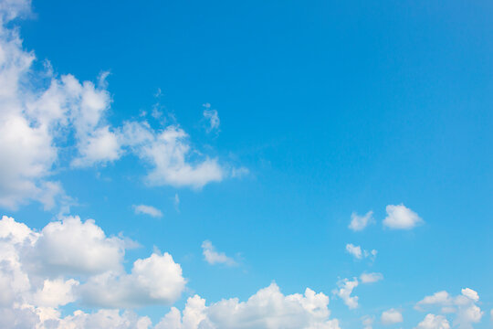 Bright sky background with few clouds.