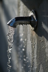 Water Pouring from Drinking Fountain on Shadow