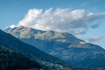 Fototapeta premium A summit taking a wonderful sunlight effect in the mountains of Switzerland