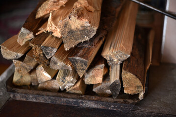 Chopped firewood. Wooden firewood for kindling the stove. Wood fuel.