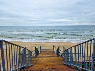 descending the stairs to the Baltic Sea in the village Miedzywodzie, Poland