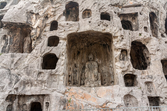 Longmen Grottoes hillside, which contains hundreds of caves with carved Buddha statues, Luoyang, China