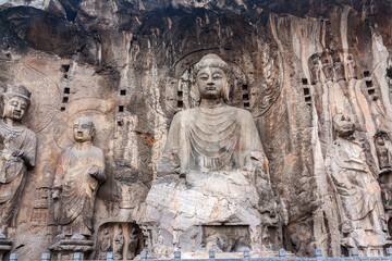 Fototapeta na wymiar Buddhist statues in Longmen Grottoes. China. This large grotto group was started from 494 AC finished about 644 AC.