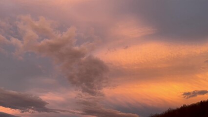 Fototapeta na wymiar Beautiful sunset sky with clouds over Carpathian mountain forest
