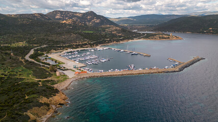 Obraz premium Aerial drone shots of the port of Teulada with Isola Rossa and Tramatzu beach with white sand and crystal clear water.