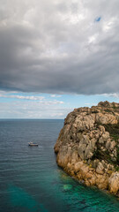 Aerial drone shots of the port of Teulada with Isola Rossa and Tramatzu beach with white sand and crystal clear water.