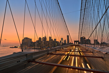 Traffic on Brooklyn Bridge with NYC skyline in the background