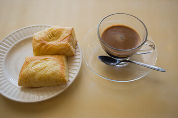 cup of coffee and croissant breakfast in the morning