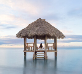 Meditation in solitude inside a beach hut