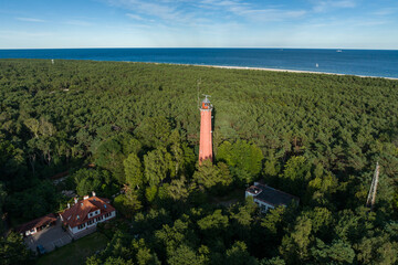 Obraz premium Lighthouse in Hel. Aerial view of Hel Peninsula in Poland, Baltic Sea and Puck Bay . Hel city.Photo made by drone from above. End of poland hel peninsula