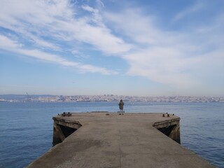 people walking on pier