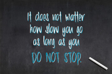 It does not matter how slow you go as long as you do not stop - Confucius quote on a blackboard