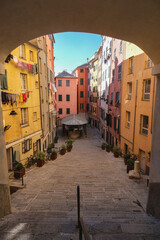Romantic backstreet, side street or alley in historic old town of Genoa, Italy with historic...
