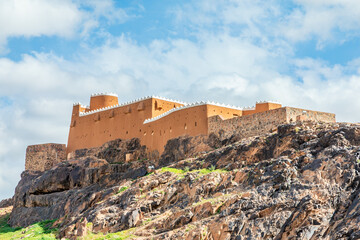 Fototapeta na wymiar Arabian Aarif fortress walls and towers standing on the hill, Hail, Saudi Arabia