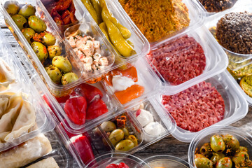 Variety of prepackaged food products in plastic boxes